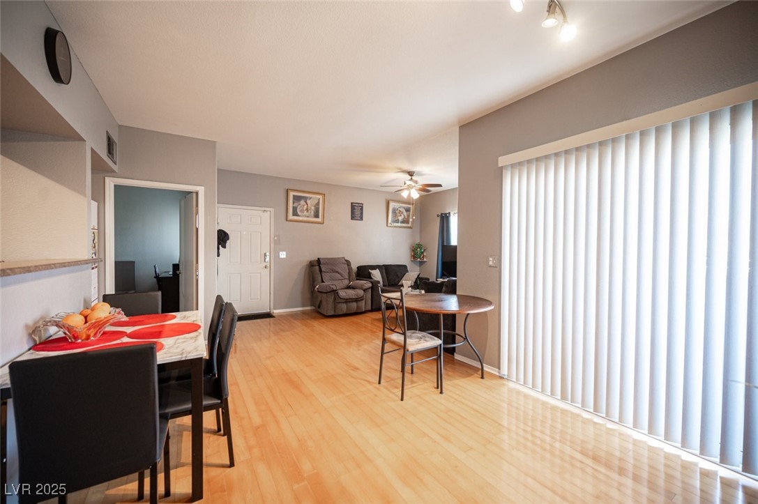 6650 West Warm Springs Road, Unit 1079 Las Vegas, NV 89118 - Photo 10 of 37 Dining space with visible vents, ceiling fan, light wood finished floors, and baseboards