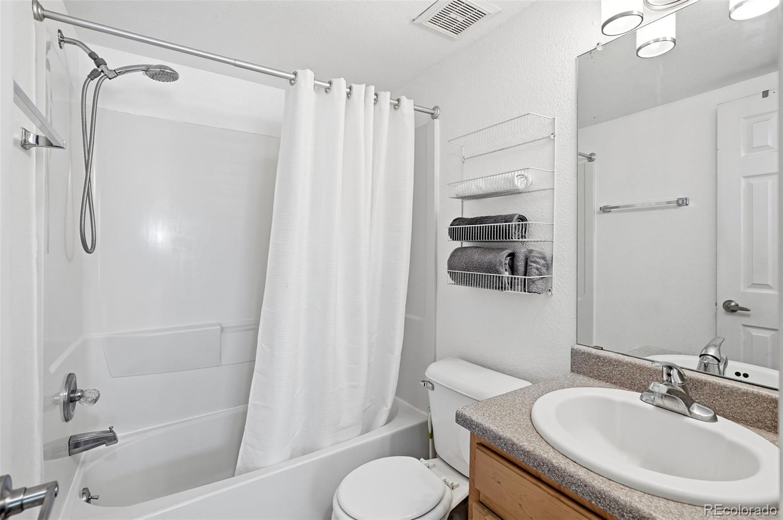 1405 Broadway, Unit 206 Boulder, CO 80302 - Photo 22 of 47 a bathroom with a sink toilet and shower