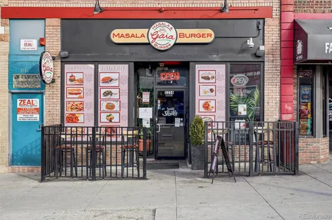 a view of a cafe with sitting area