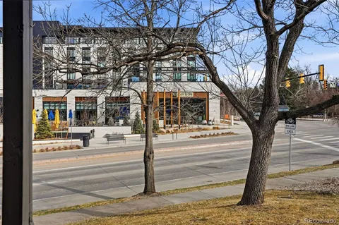 a kitchen with granite countertop a refrigerator and a stove