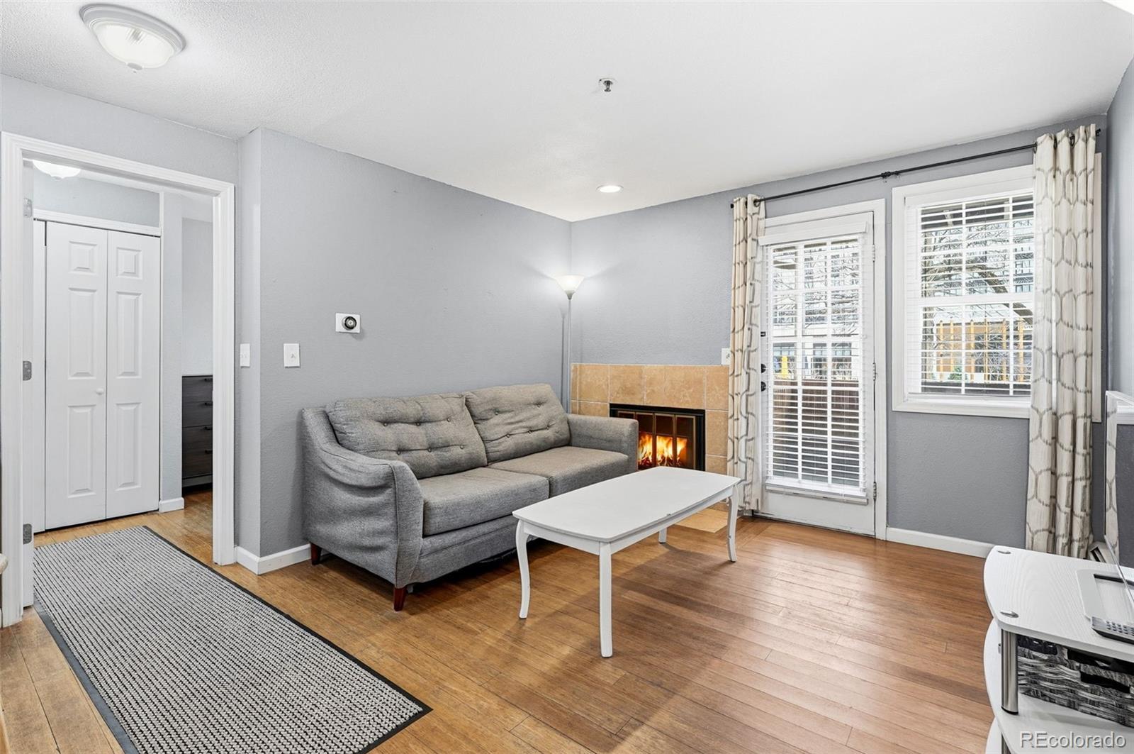 1405 Broadway, Unit 206 Boulder, CO 80302 - Photo 9 of 47 a living room with furniture and a window