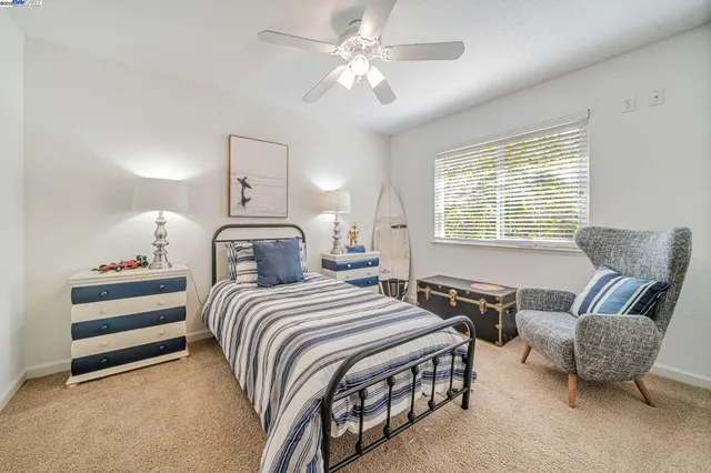 a bedroom with bed and a couch