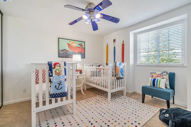 a bedroom with furniture and a window
