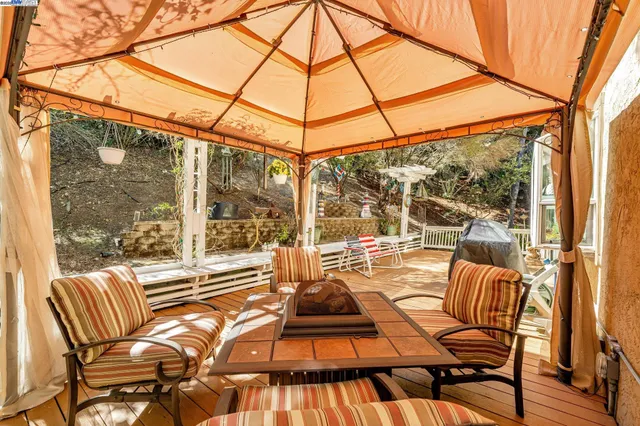 a view of a two chairs in the balcony
