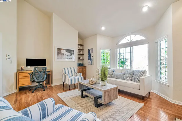 a living room with furniture or couch and a wooden floor