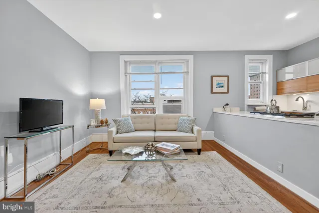 a living room with furniture and window