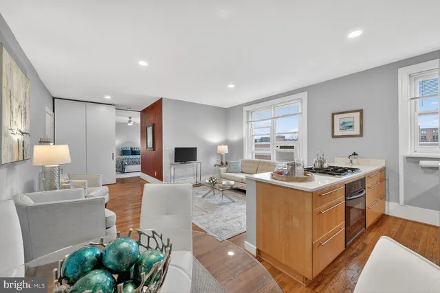 a kitchen that has a sink and a stove