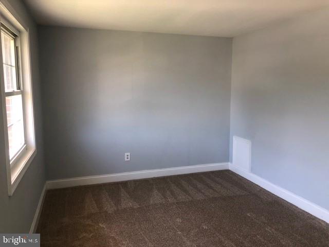 8535 Neptune Drive Pasadena, MD 21122 - Photo 7 of 7 an empty room with a window