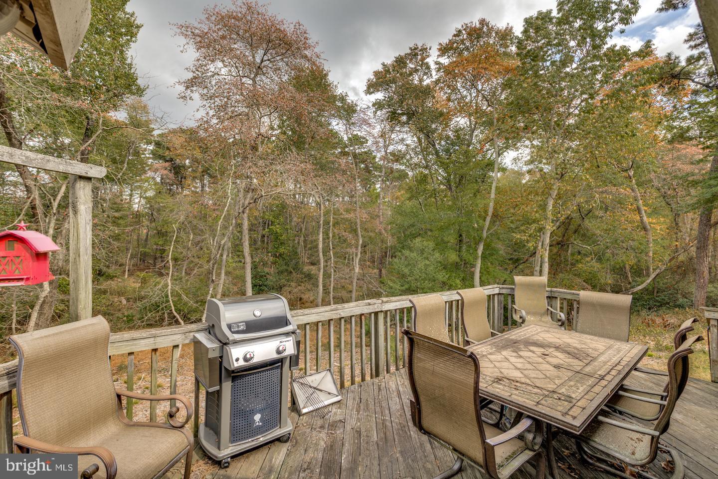20 Sooy Place Road Southampton, NJ 08088 - Photo 30 of 47 a view of a patio with table and chairs and wooden floor