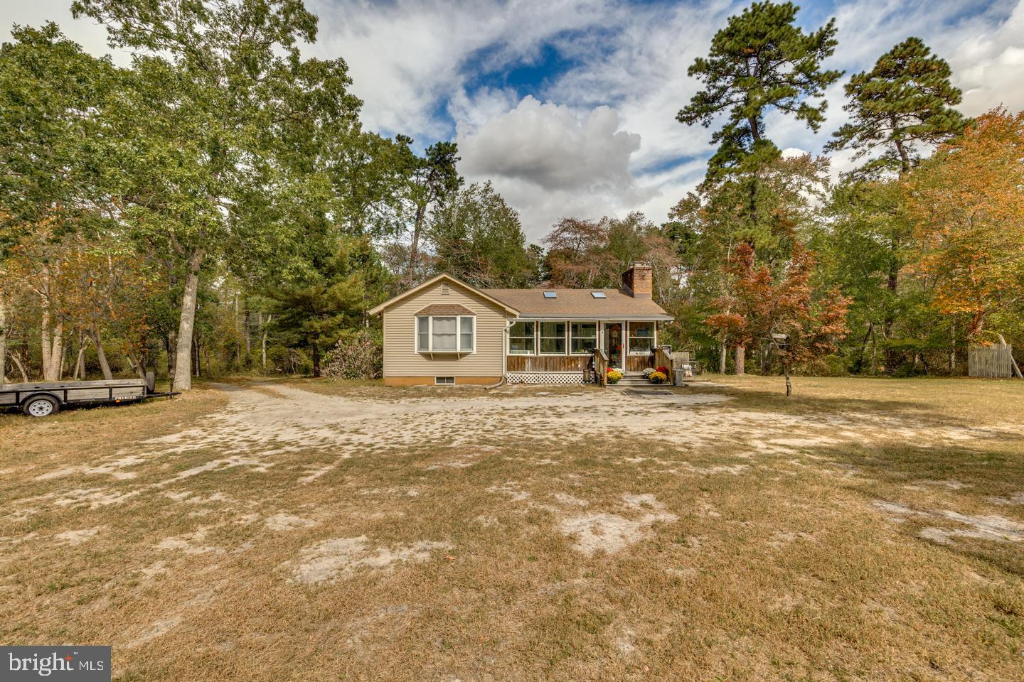 20 Sooy Place Road Southampton, NJ 08088 - Photo 7 of 47 a front view of a house with a yard and garage