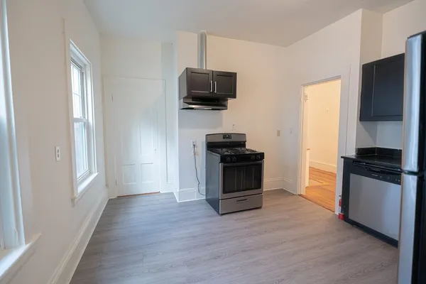 a kitchen with a stove and a microwave