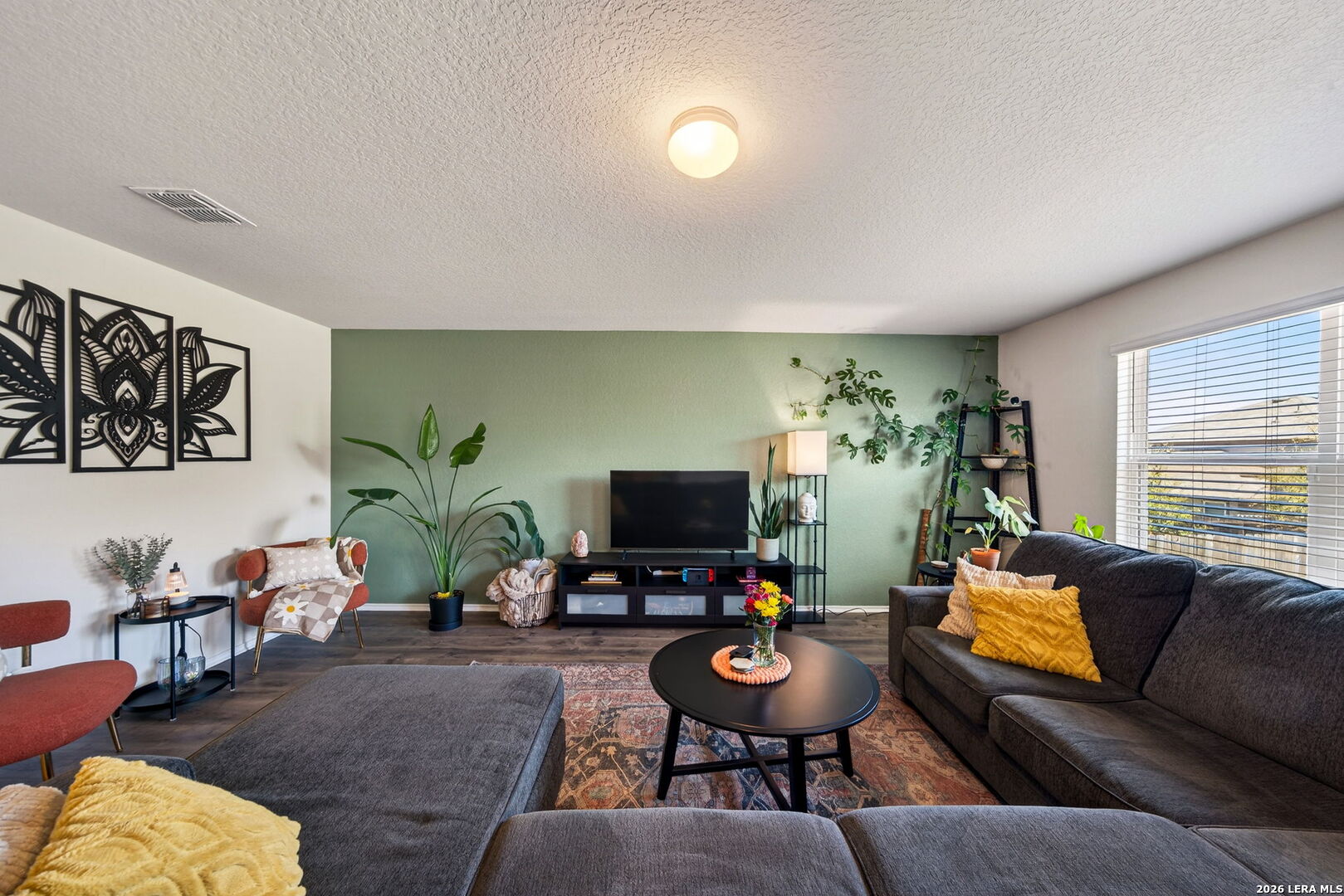 29546 Lost Copper Bulverde, TX 78163 - Photo 6 of 35 a living room with furniture and a flat screen tv