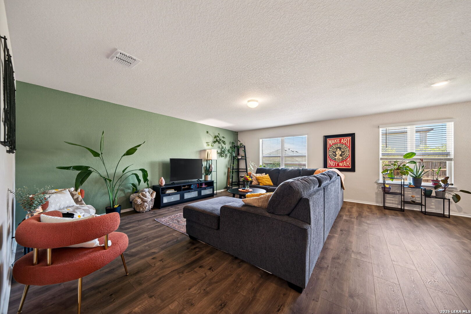 29546 Lost Copper Bulverde, TX 78163 - Photo 8 of 35 a living room with furniture and a flat screen tv
