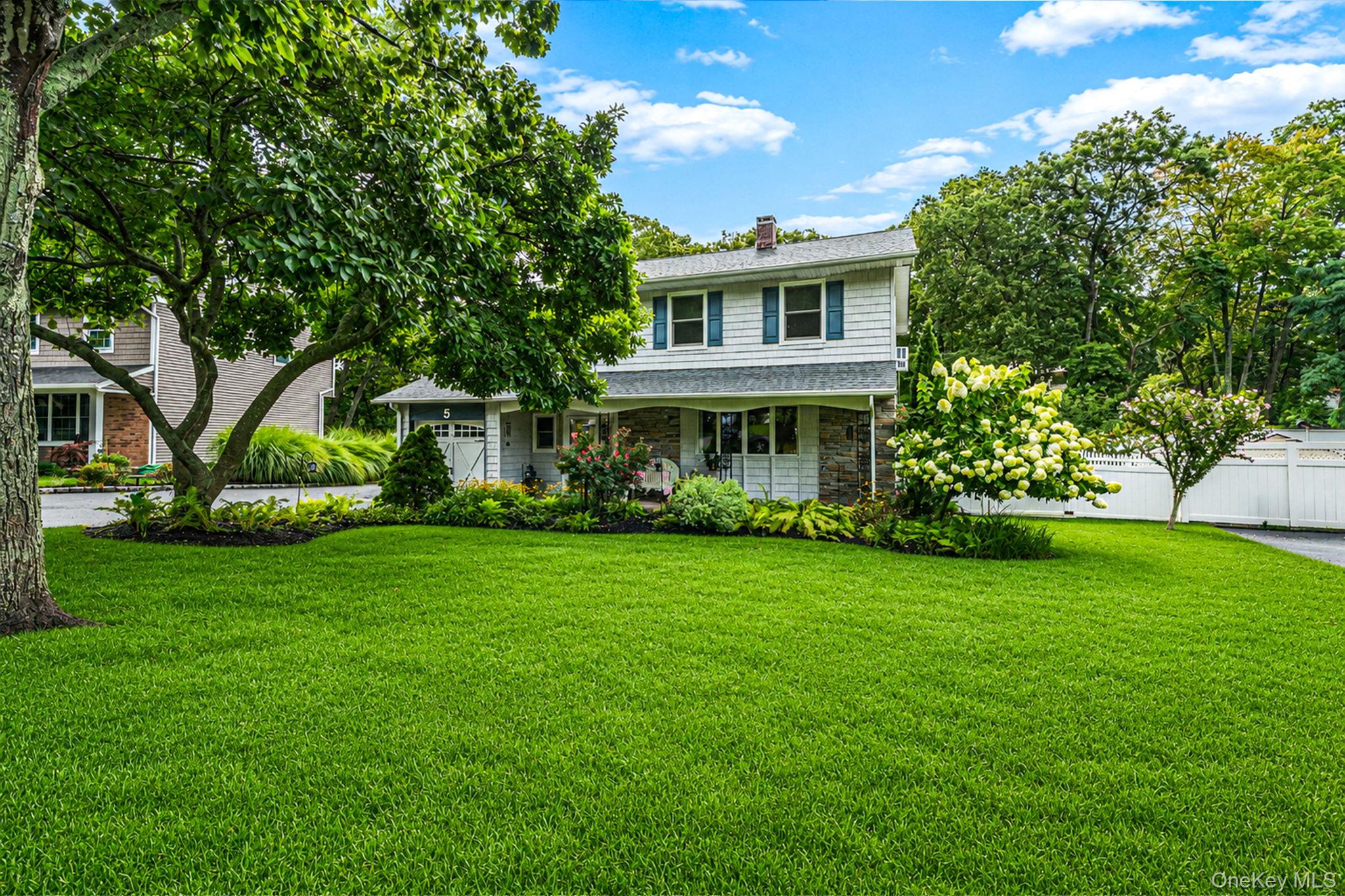 5 Rockhill Road Rocky Point, NY 11778 - Photo 3 of 48 Expansive front lawn with mature trees and established landscaping
