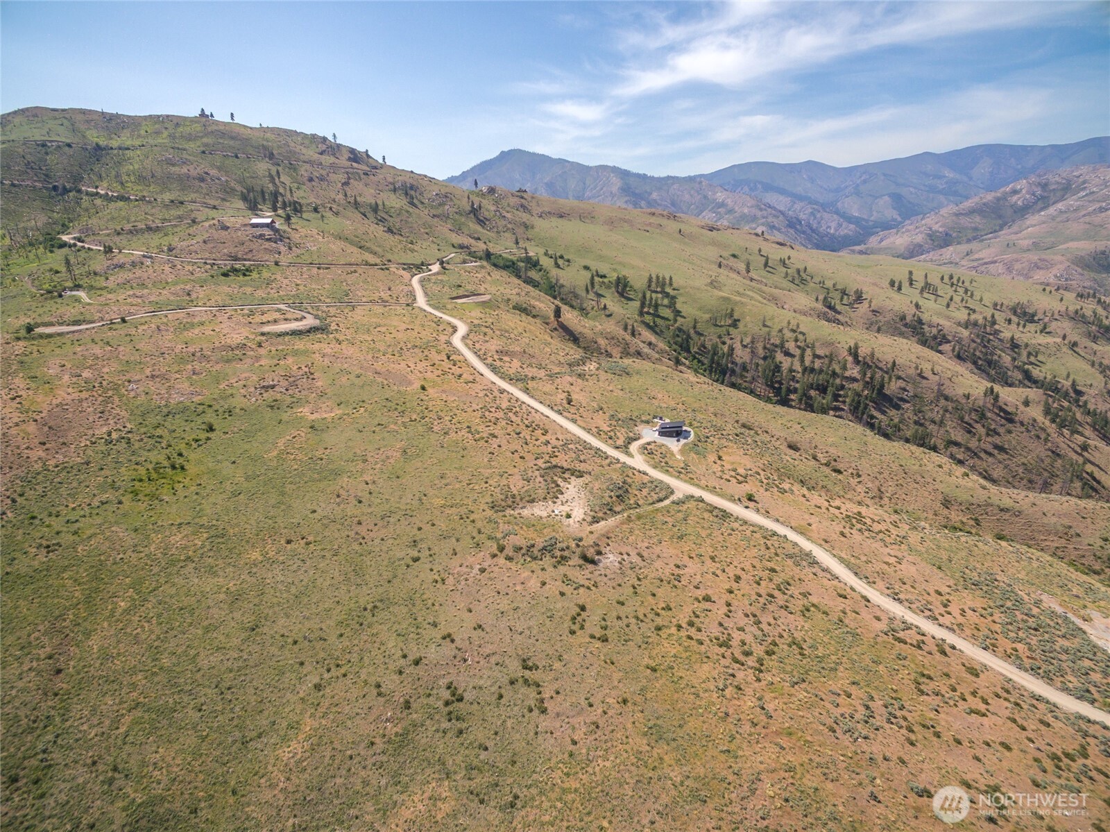 15 Cowboy Road Pateros, WA 98846 - Photo 15 of 15 a view of a dry yard with mountains in the background