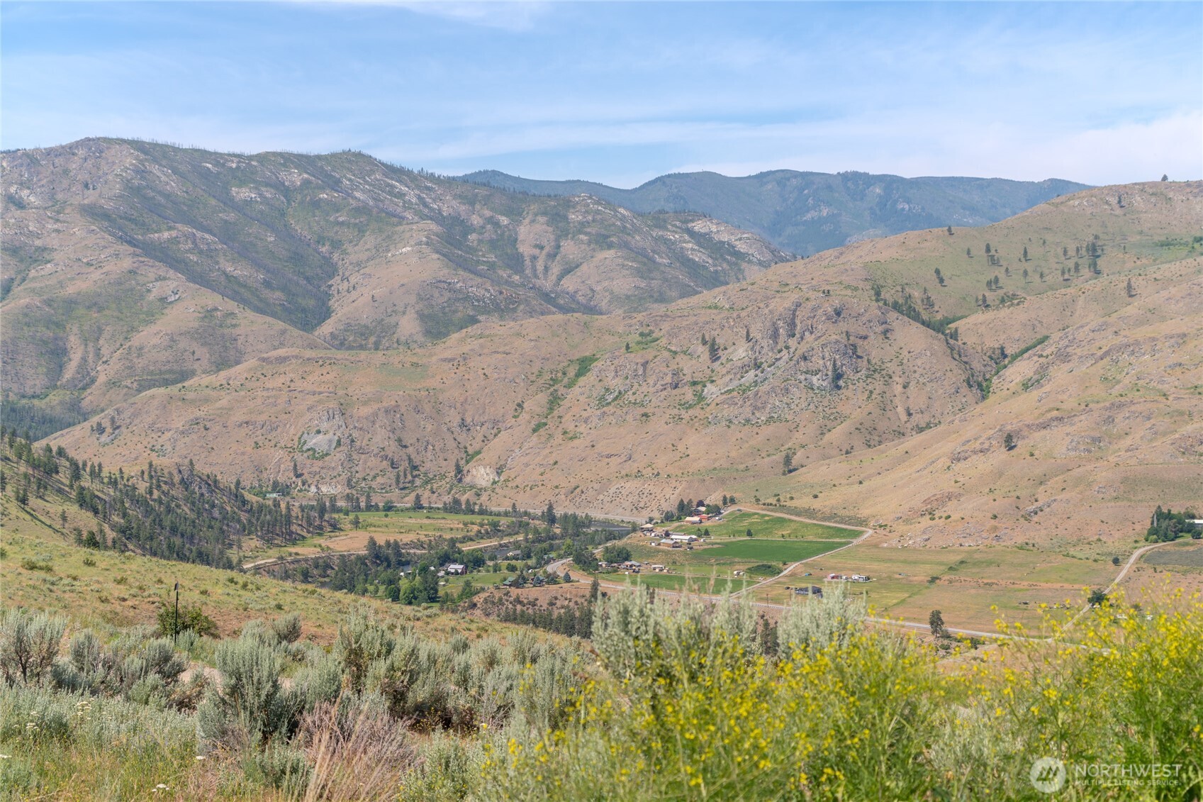15 Cowboy Road Pateros, WA 98846 - Photo 10 of 15 a view of a lake with mountains in the background