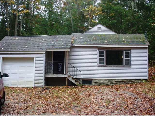 546 River Road Putnam, CT 06260 - Photo 1 of 1 a front view of a house with a garden