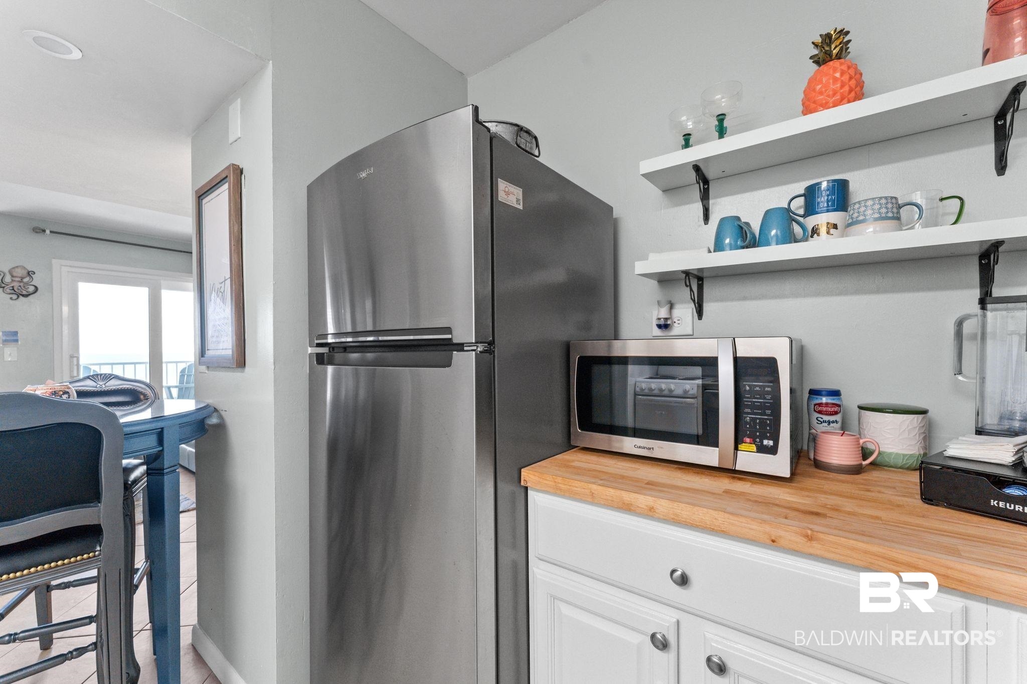 375 Plantation Road, Unit 5803 Gulf Shores, AL 36542 - Photo 8 of 37 Kitchen featuring appliances with stainless steel finishes, butcher block countertops, white cabinets, and open shelves
