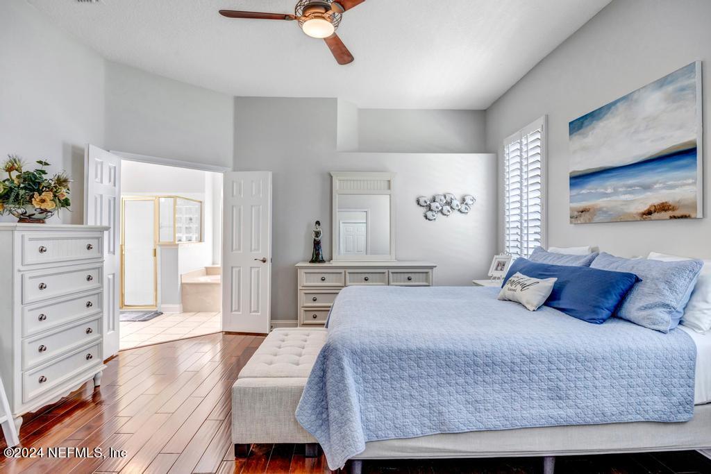 757 Mill Stream Road Ponte Vedra Beach, FL 32082 - Photo 31 of 65 a bedroom with a large bed and a dresser