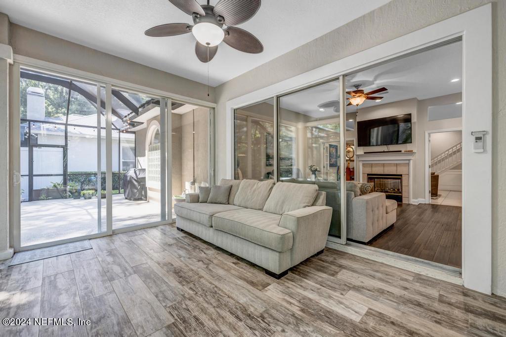 757 Mill Stream Road Ponte Vedra Beach, FL 32082 - Photo 50 of 65 a living room with furniture a flat screen tv and a fireplace