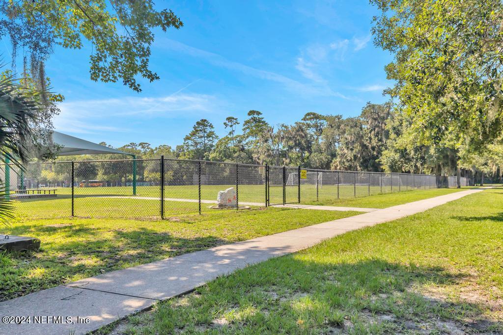 757 Mill Stream Road Ponte Vedra Beach, FL 32082 - Photo 60 of 65 a view of a swimming pool with an outdoor space and seating area