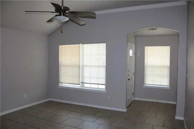 a view of an empty room and a window