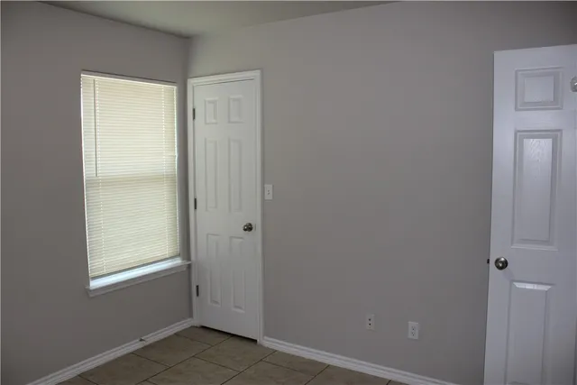 a bathroom with a double vanity sink and mirror with shower