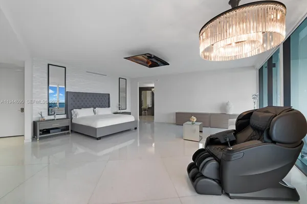 en view of a hallway with chandelier