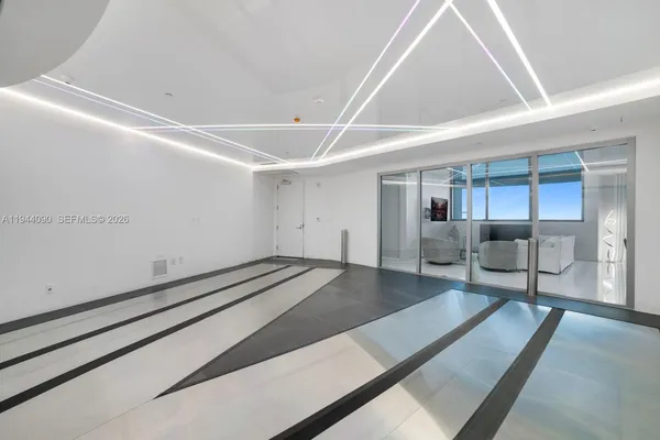a kitchen with kitchen island a counter top space and stainless steel appliances
