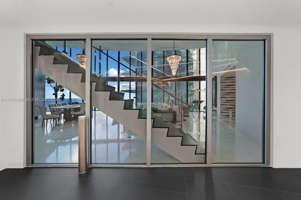 a view of a elevator with glass door and windows