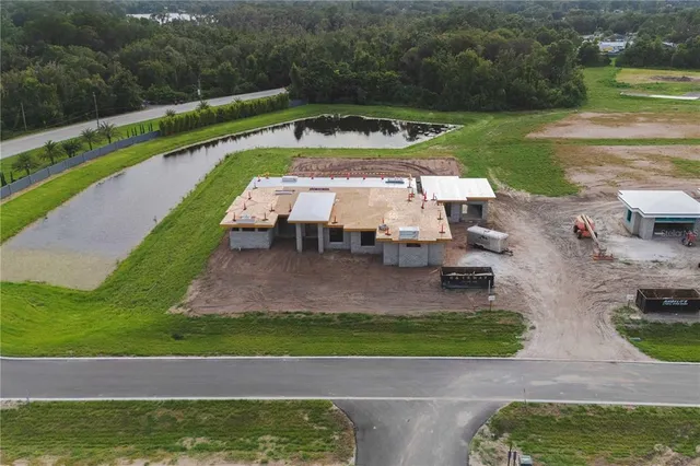 a view of a swimming pool with a yard