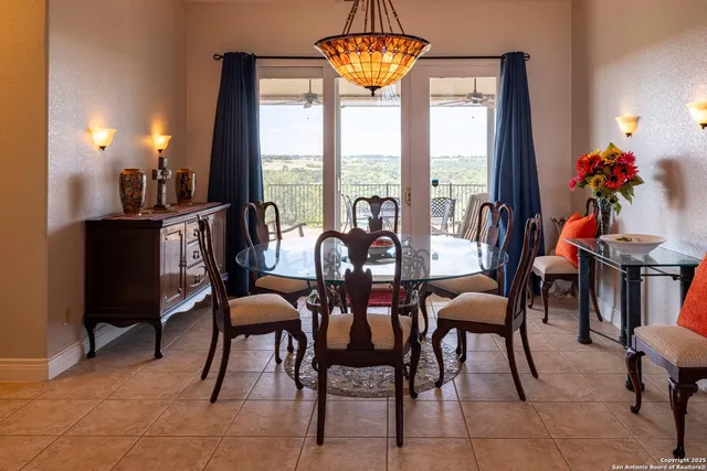 a view of a dining room with furniture window and outside view