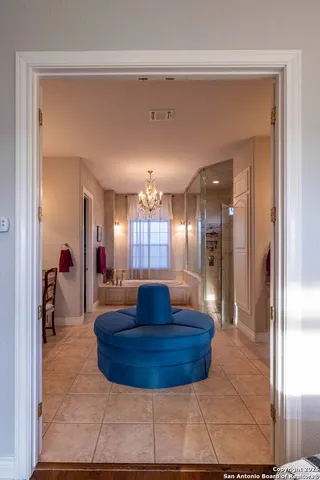 a view of a lobby area with mirror and window