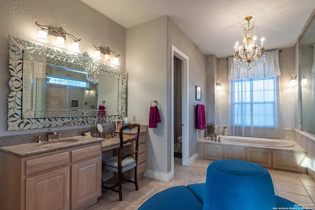 a bathroom with a tub sink and mirror