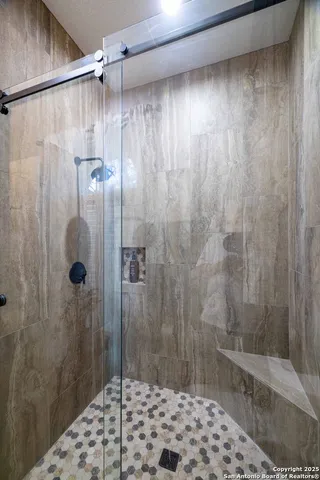 a bathroom with a shower and a toilet