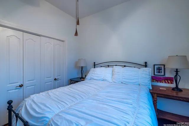 a bed room with a bed and a book shelf