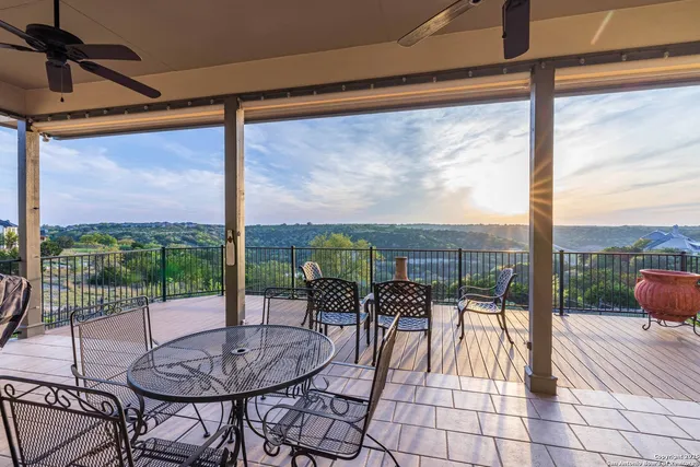 a view of a patio with a table chairs and a table
