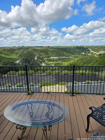 a view of balcony with wooden floor