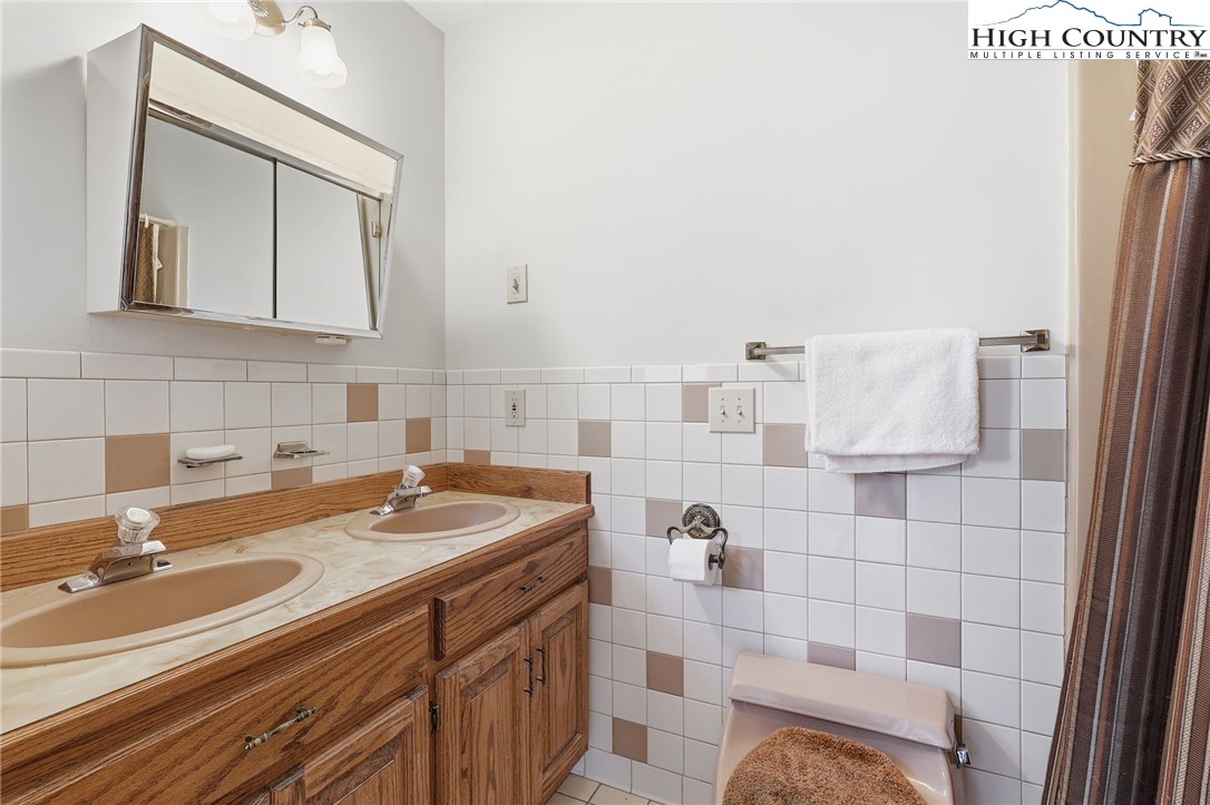 206 Lane L Massey Road Crumpler, NC 28617 - Photo 14 of 36 a bathroom with a sink and a mirror