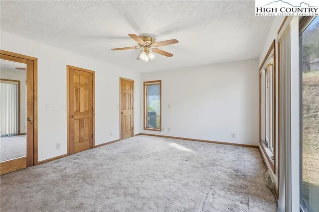 a view of an empty room and window