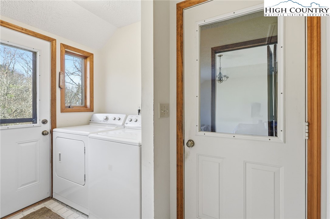 206 Lane L Massey Road Crumpler, NC 28617 - Photo 22 of 36 a utility room with a window dryer and washer
