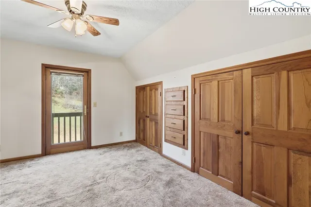 an empty room with windows closet and windows