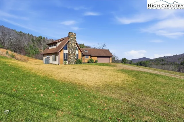 a house view with a lake view