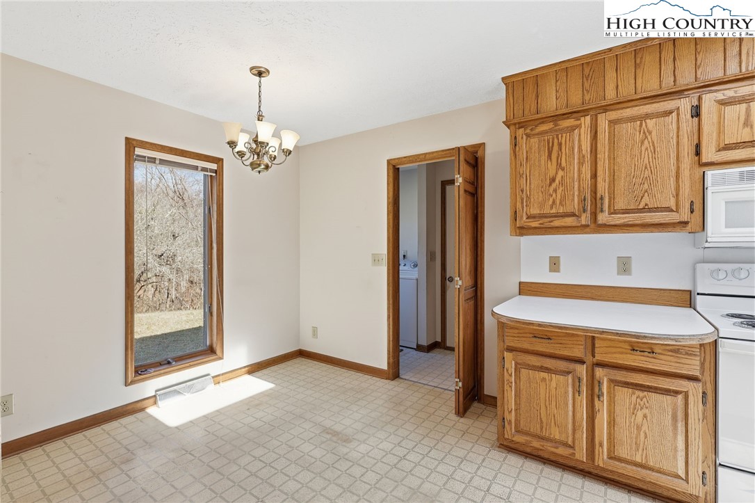 206 Lane L Massey Road Crumpler, NC 28617 - Photo 6 of 36 a kitchen that has a cabinets and a stove