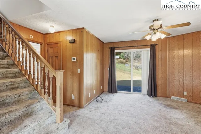 a view of a hallway with entryway door