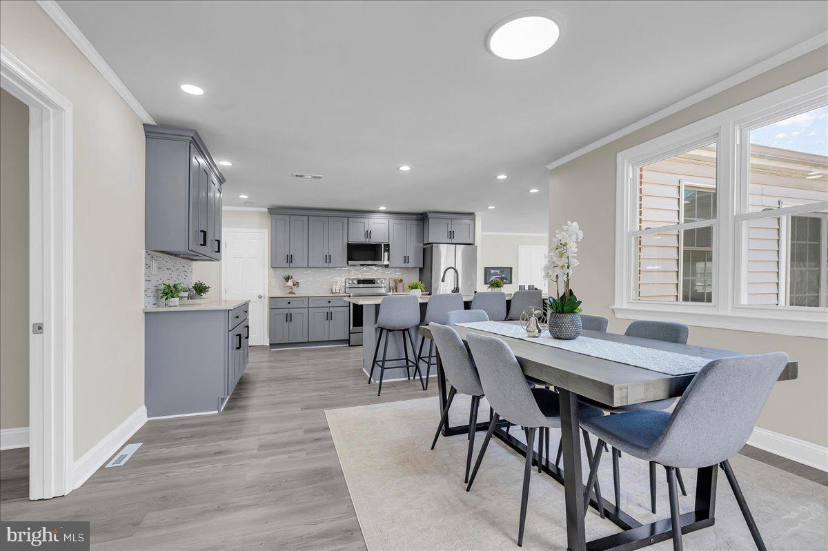 12 West Dale Road Wilmington, DE 19810 - Photo 14 of 44 a view of a dining room with furniture and windows