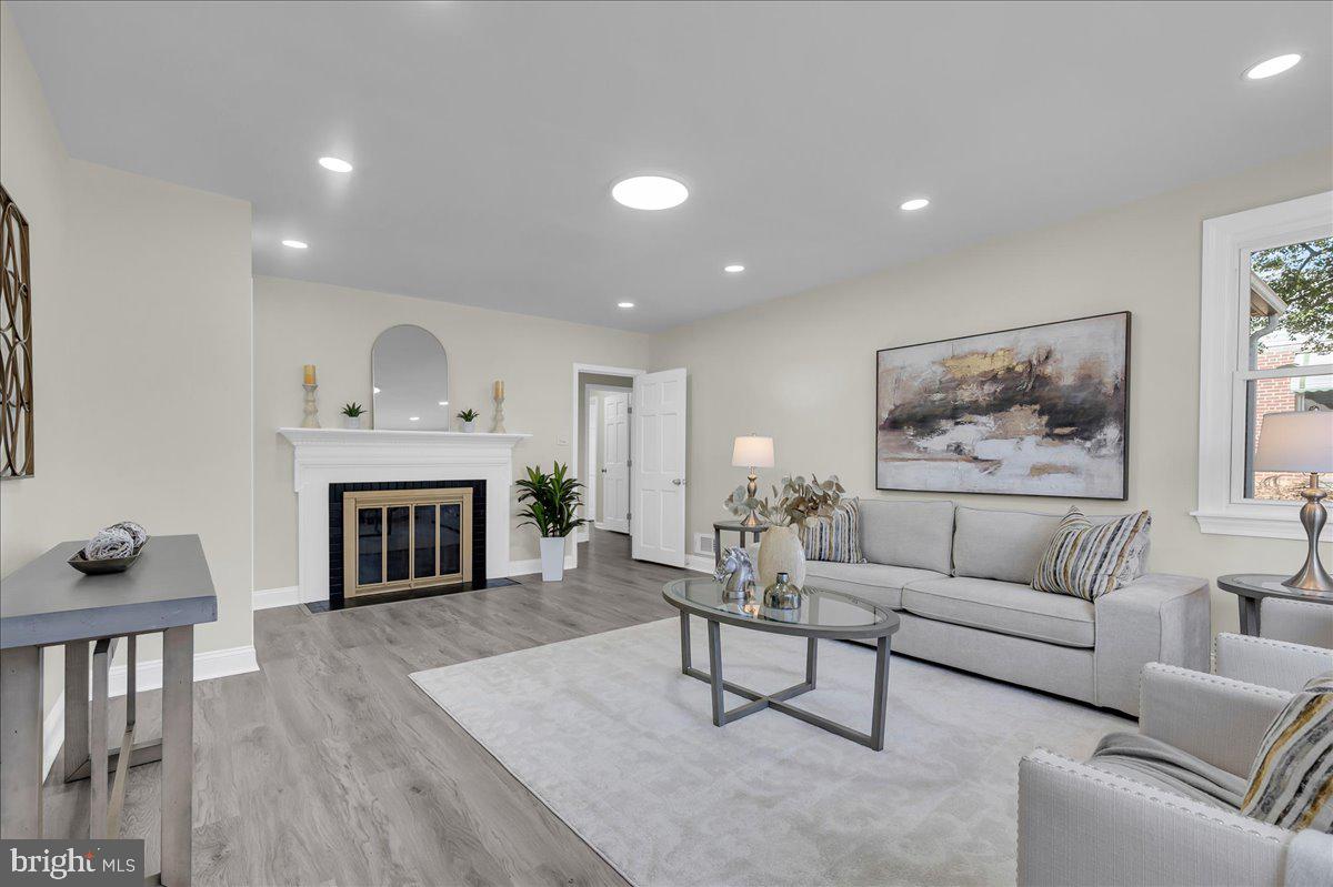 12 West Dale Road Wilmington, DE 19810 - Photo 19 of 44 a living room with furniture and a fireplace
