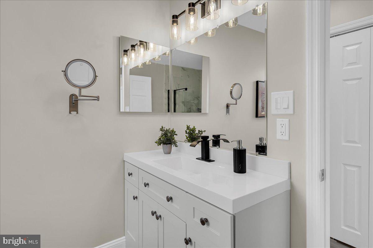 12 West Dale Road Wilmington, DE 19810 - Photo 23 of 44 a bathroom with a sink and a mirror