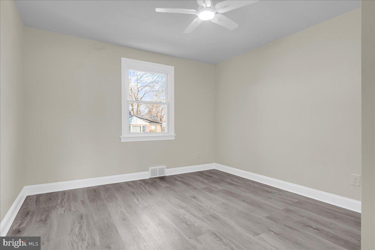 12 West Dale Road Wilmington, DE 19810 - Photo 25 of 44 a view of a big room with wooden floor and windows