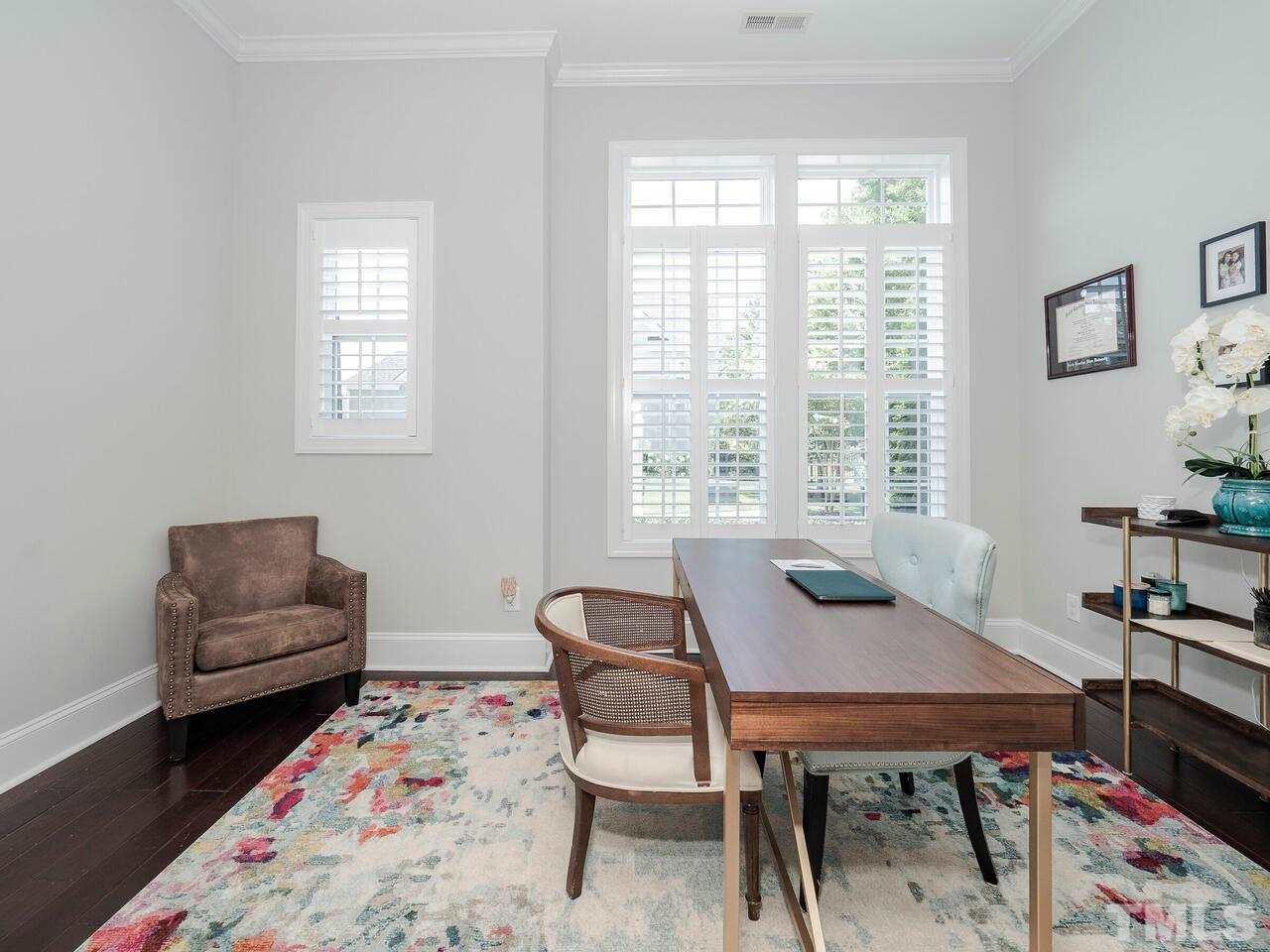 3936 Ivory Rose Lane Raleigh, NC 27612 - Photo 3 of 12 a view of a livingroom with furniture and a window